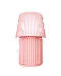 Kono Blush table lamp by Lempori with a ribbed flared shade and cylindrical base on a white background.