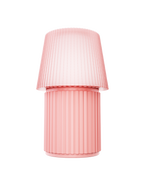 Kono Blush table lamp by Lempori with a ribbed flared shade and cylindrical base on a white background.