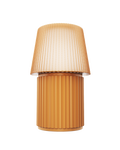 Kono Honey table lamp by Lempori with a ribbed fluted base and matching shade on a white background.