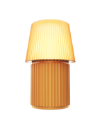 Kono Honey table lamp by Lempori illuminated with warm white LED light on a white background.