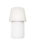Kono Ivory table lamp by Lempori with a ribbed fluted base and matching shade on a white background.