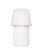 Kono Ivory table lamp by Lempori with a ribbed fluted base and matching shade on a white background.