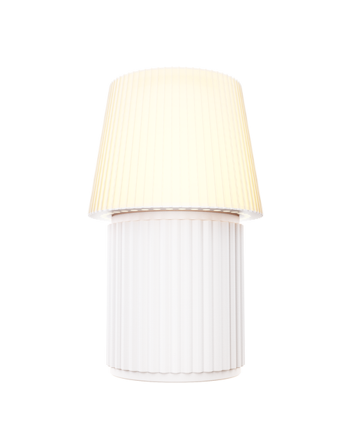Kono Ivory table lamp by Lempori illuminated with warm white LED light on a white background.