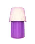 Kono Lavender table lamp by Lempori illuminated with warm white LED light on a white background.