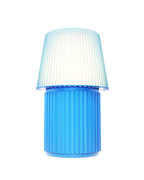 Kono Sky table lamp by Lempori illuminated with warm white LED light on a white background.